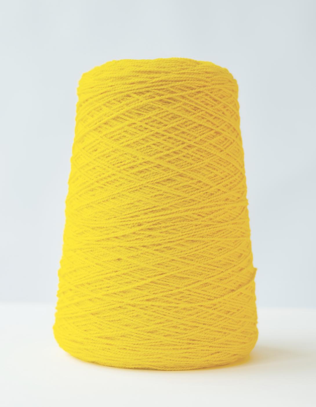 Cone of yellow yarn